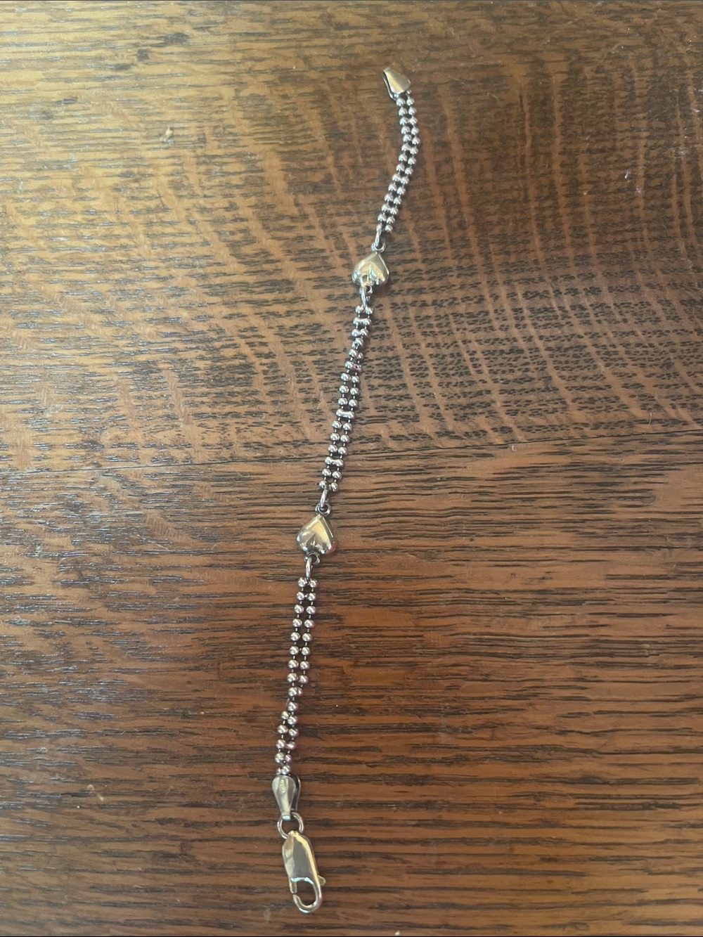 Silver and gold ( plated? Heart) bracelet.